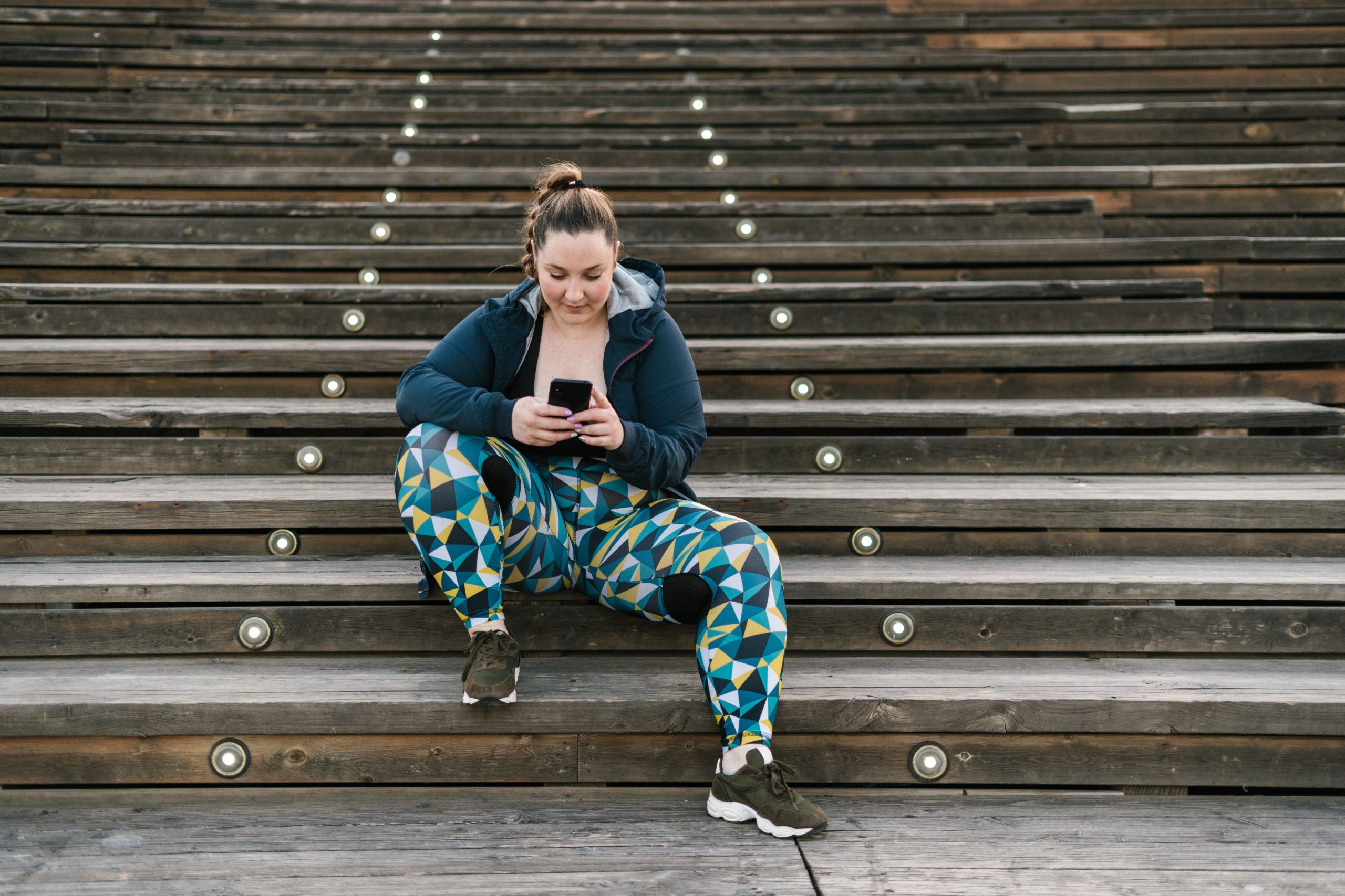 Woman at stairs texting