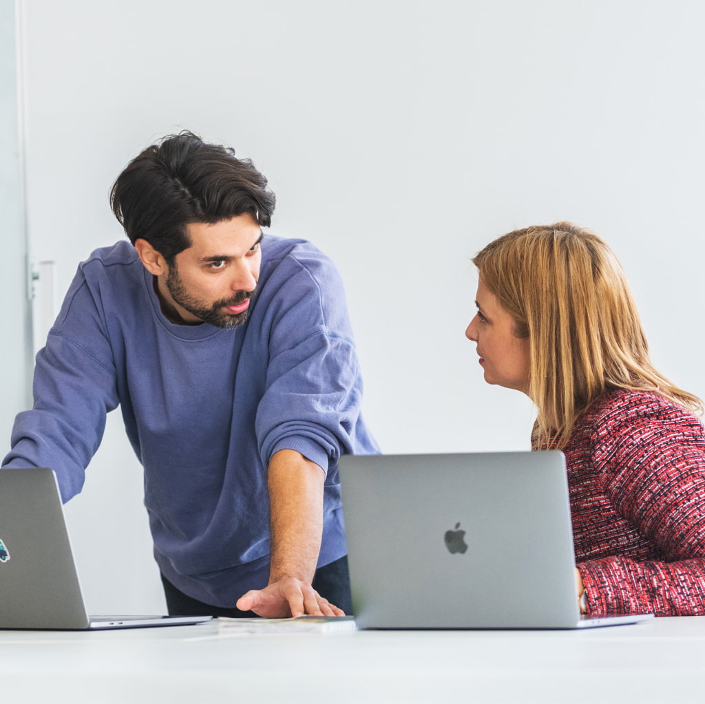 Colleagues discussing over a project