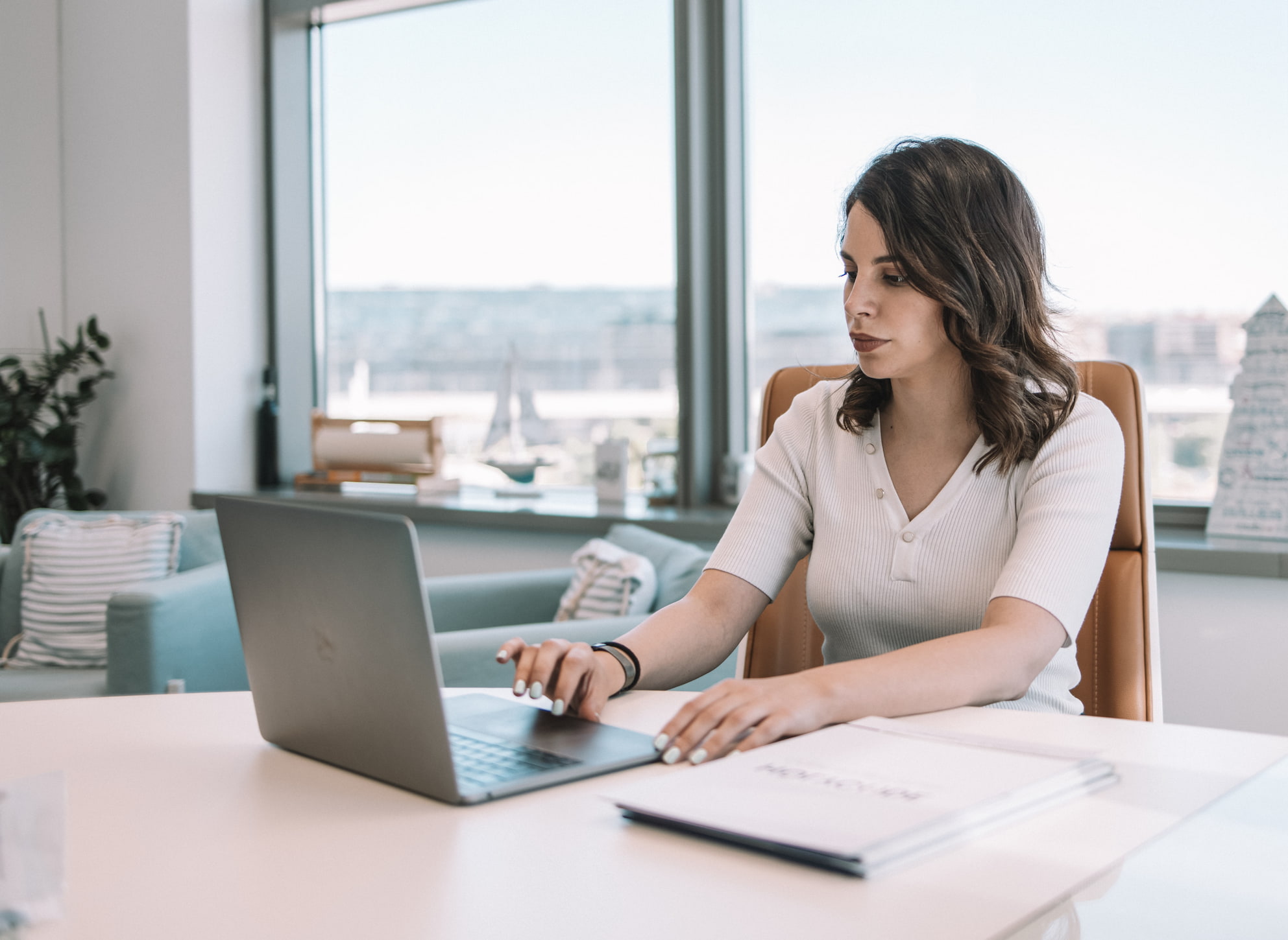 Woman working on computer at office