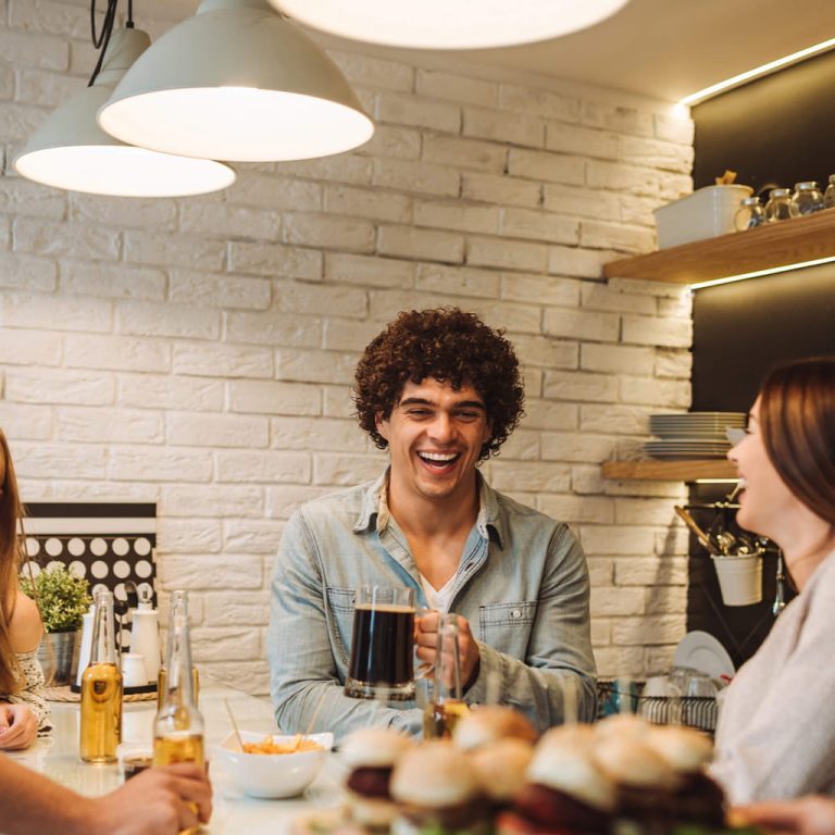 Friends at table laughing