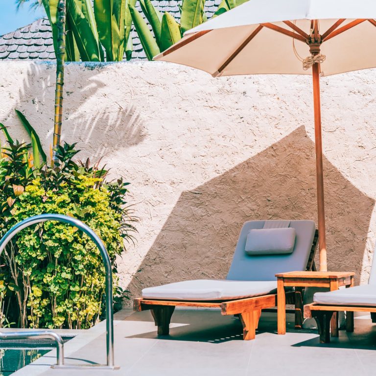 umbrella chair around swimming pool