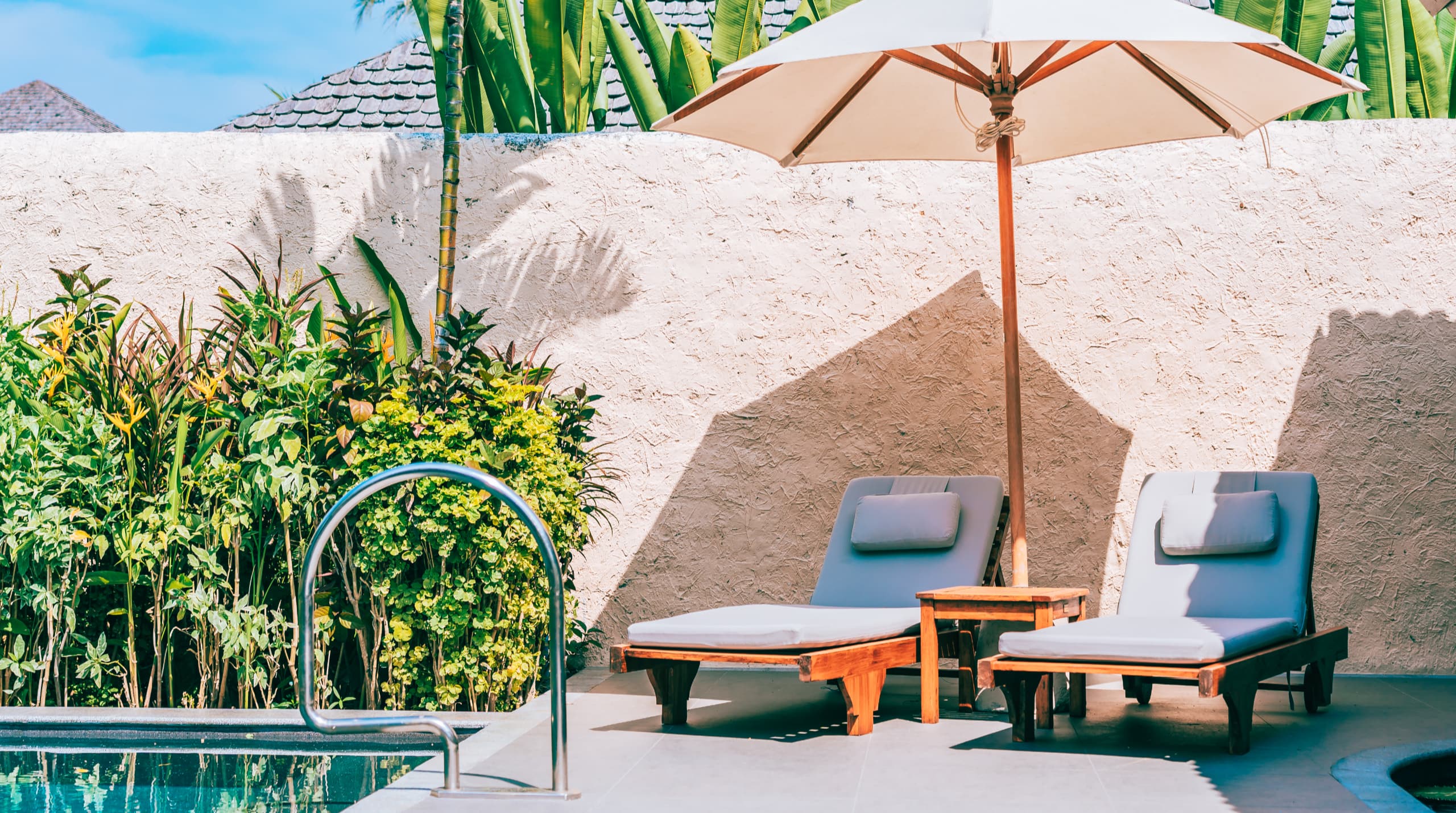 umbrella chair around swimming pool