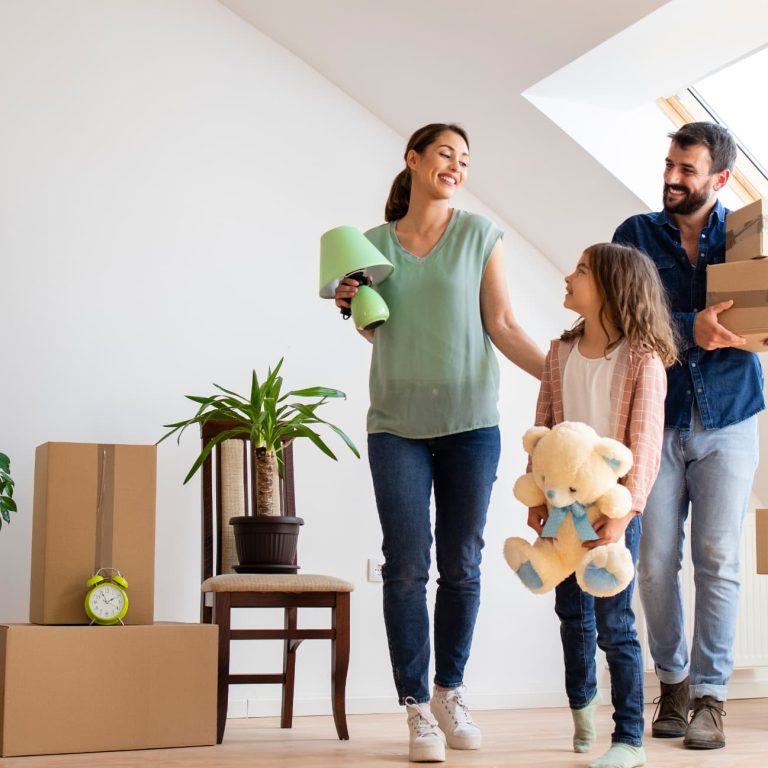 Happy caucasian family moving in new apartment