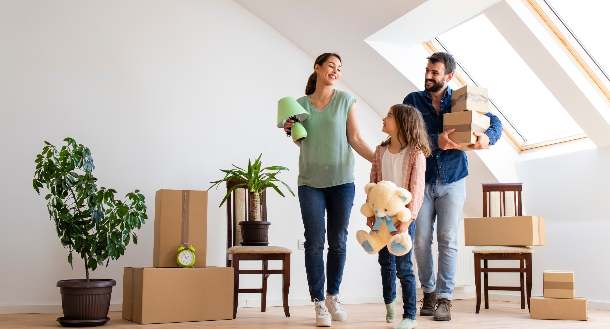 Happy caucasian family moving in new apartment