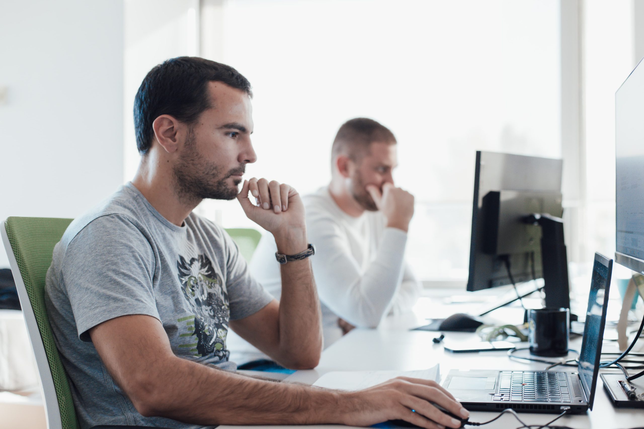 QA engineers working on a project in an office