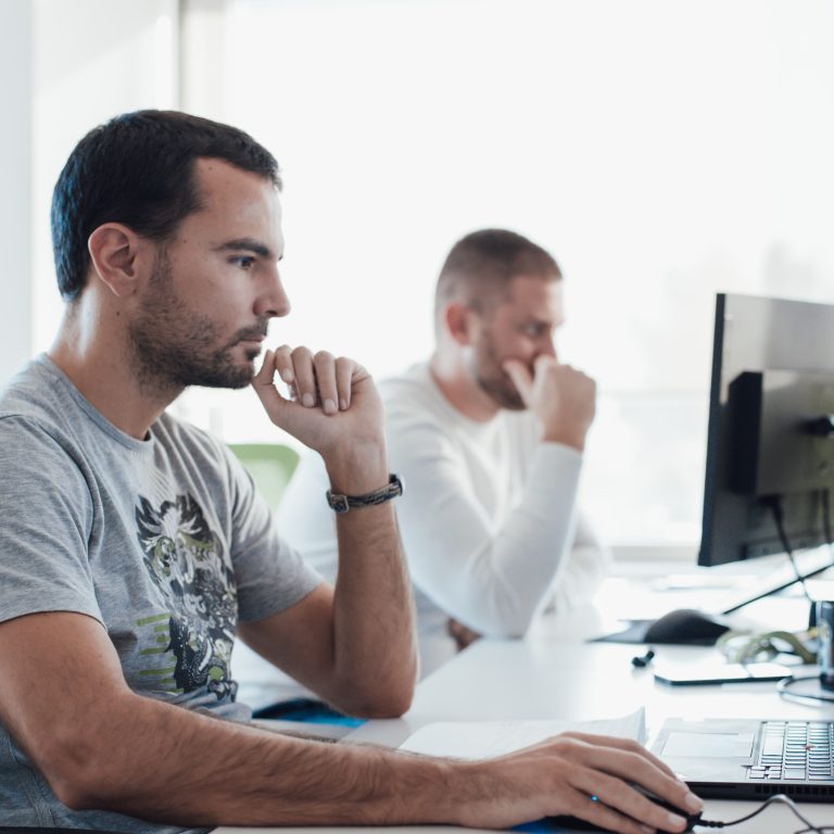QA engineers working on a project in an office
